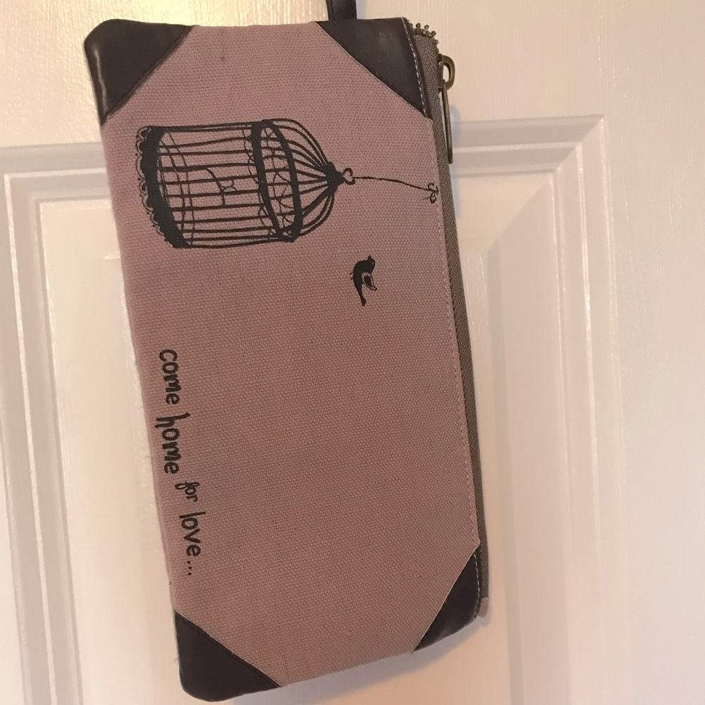 Light purple Natural Life wristlet with small leather strap. Never used